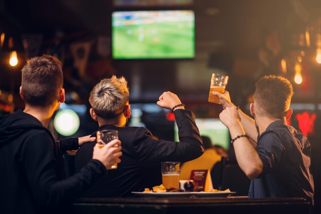 Group of friends watching the football