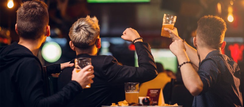 Group of friends watching the football